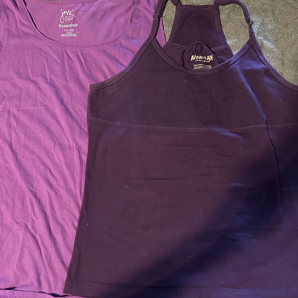 Two purple tank tops. Sizes are shown in pictures. Both soft and comfortable.